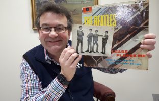Rare signed Beatles photo to be auctioned in Staffordshire Auctioneer Richard Winterton with the rare autographed photo and a copy of The Beatles’ first LP Please Please Me.