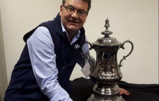 This FA Cup trophy is being auctioned in Staffordshire (but all is not as it seems) He can dream! Auctioneer Richard Winterton with the replica FA Cup.