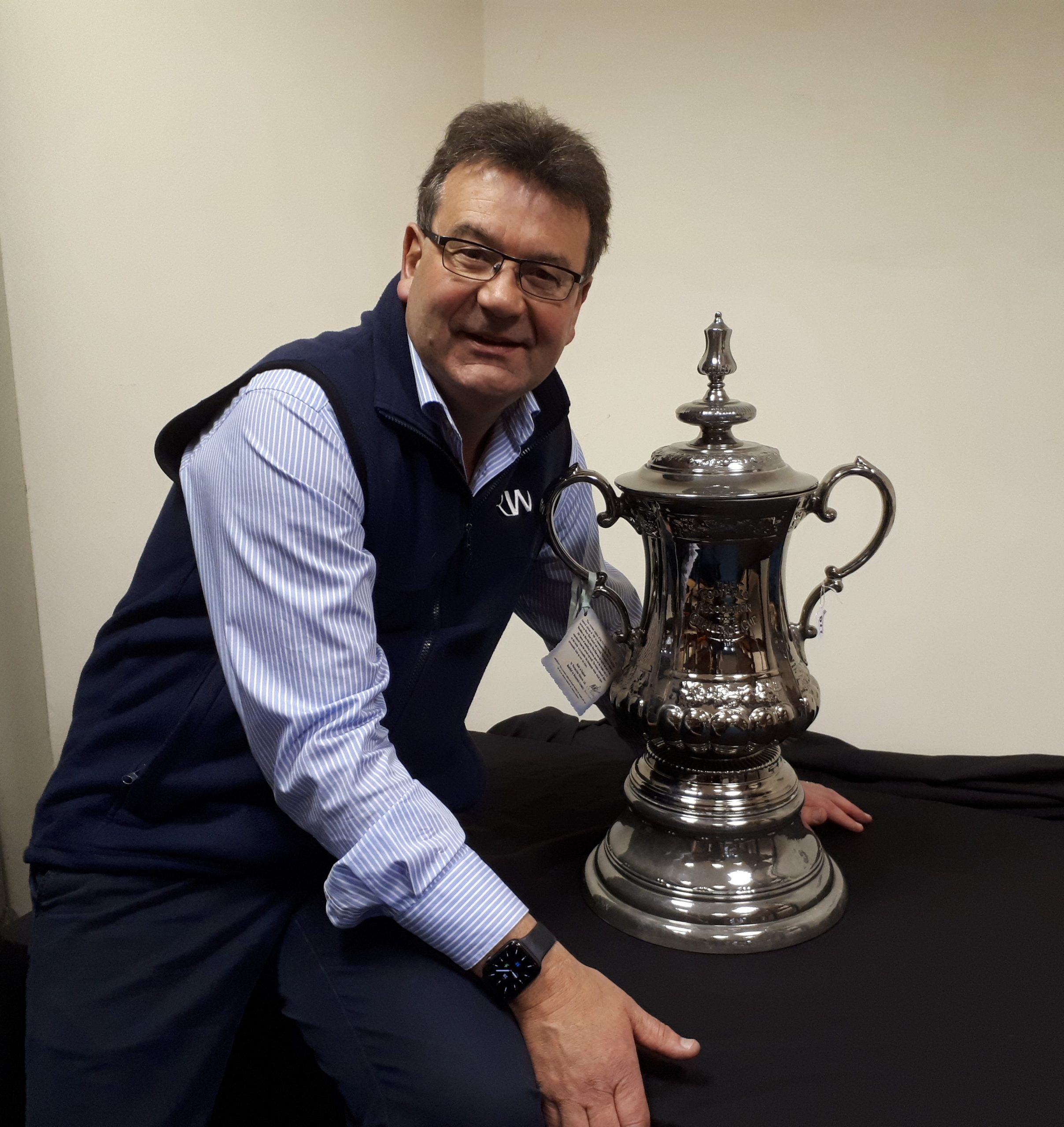 He can dream! Auctioneer Richard Winterton with the replica FA Cup.