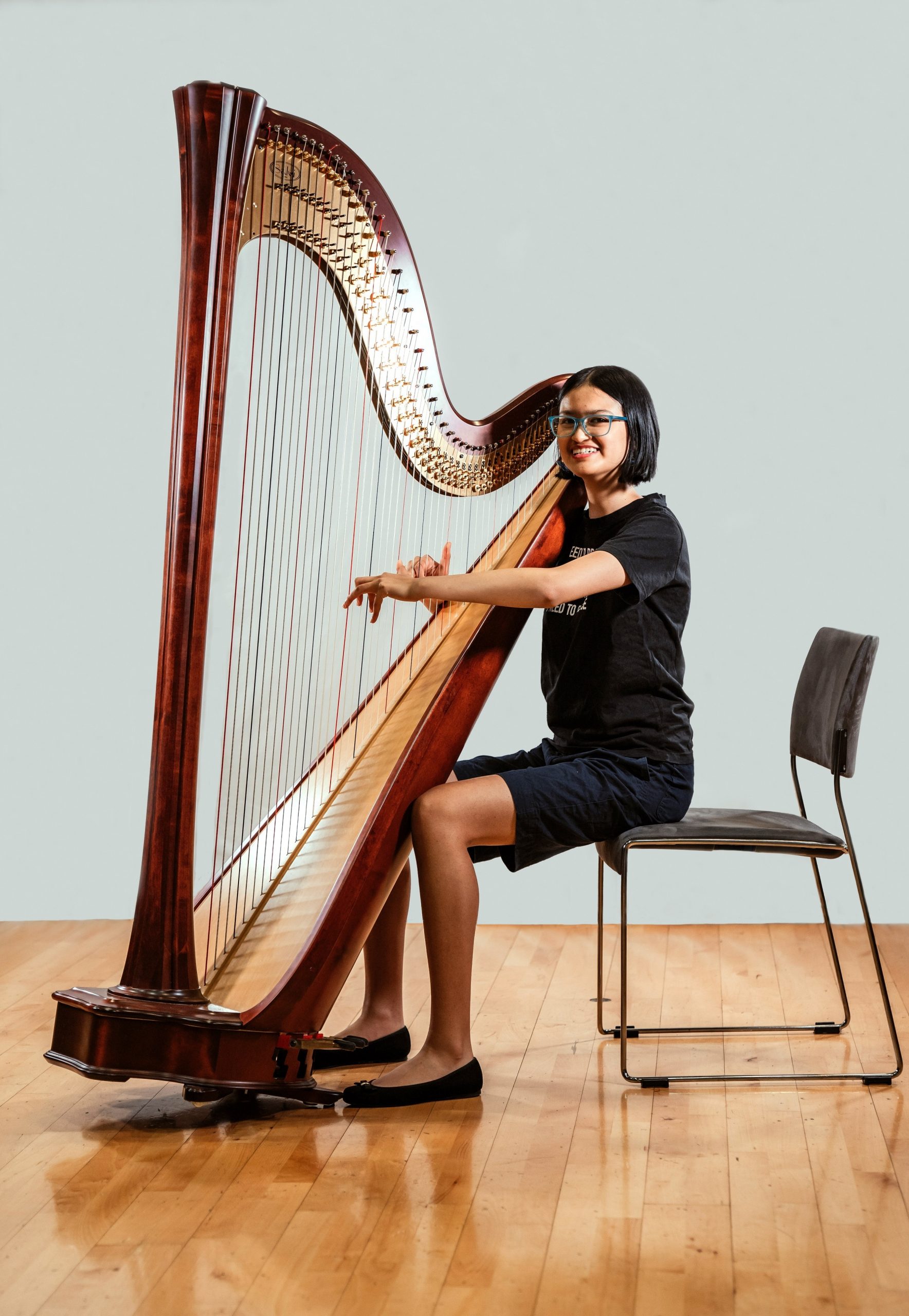 Young musician with harp